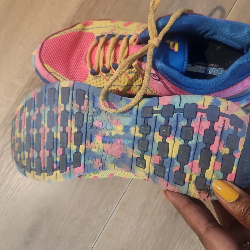 Fila multi color tennis shoe. Pink, yellow, and blue. Great tread. Yellow laces